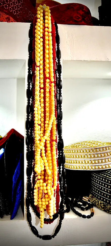 SND Clothing Design amber and black bead strands