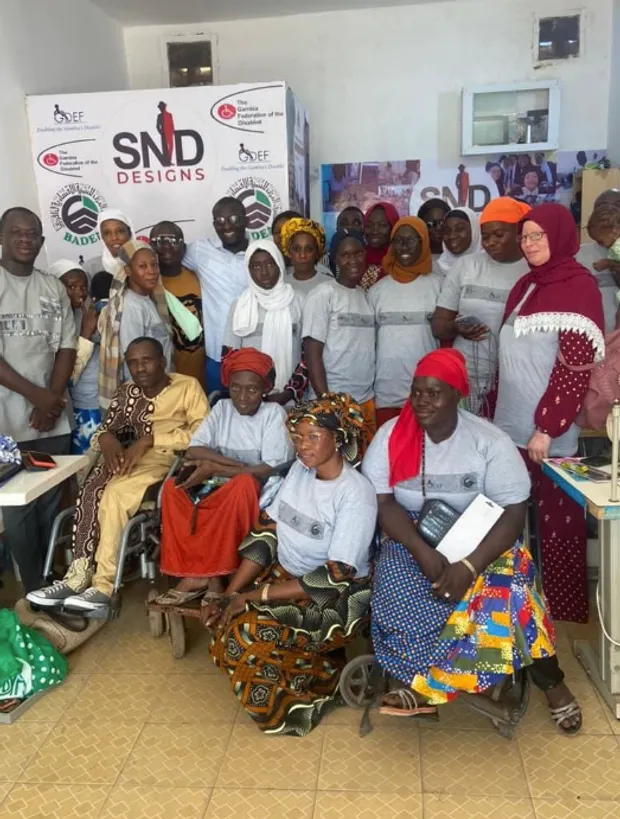 SND Clothing Design second-batch tailoring graduates — persons with disabilities, with Heenoo International Foundation and the Gambia Federation of the Disabled